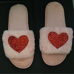 Pink Valentine’s fuzzy slippers.